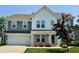 Charming two-story home features a brick and siding facade, well-manicured lawn, and an attached two-car garage at 5303 Rum Cherry Way, Indianapolis, IN 46237
