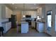 Bright kitchen featuring stainless steel appliances, granite countertops, tiled floor and white cabinets at 5303 Rum Cherry Way, Indianapolis, IN 46237