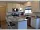 Bright kitchen featuring stainless steel appliances, granite countertops, tiled floor and white cabinets at 5303 Rum Cherry Way, Indianapolis, IN 46237