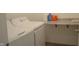 Laundry room featuring modern washer and dryer with a countertop for folding and organizing at 5303 Rum Cherry Way, Indianapolis, IN 46237