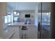 Open concept living room with a gray sofa and view to kitchen island at 5303 Rum Cherry Way, Indianapolis, IN 46237