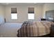 Spacious main bedroom featuring neutral carpeting and natural light from double windows at 5303 Rum Cherry Way, Indianapolis, IN 46237