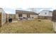 Spacious backyard with patio, outdoor seating, grill, and fire pit at 5832 Emmert Way, Indianapolis, IN 46221
