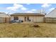 Large backyard with patio and outdoor seating area, great for gatherings at 5832 Emmert Way, Indianapolis, IN 46221