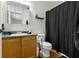 Cozy bathroom with vanity, toilet, shower-tub combo, and modern fixtures at 5832 Emmert Way, Indianapolis, IN 46221