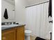Classic bathroom with vanity, toilet, shower-tub combo, and a window at 5832 Emmert Way, Indianapolis, IN 46221