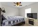 Bedroom with a window, ceiling fan, carpeted floors, and TV at 5832 Emmert Way, Indianapolis, IN 46221