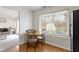 Bright breakfast nook featuring hardwood floors and a window overlooking the yard at 5832 Emmert Way, Indianapolis, IN 46221