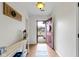 Bright entryway boasts hardwood floors and a rustic console table with decor at 5832 Emmert Way, Indianapolis, IN 46221