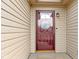 Inviting front door features glass pane with decorative welcome decal and sidelight at 5832 Emmert Way, Indianapolis, IN 46221