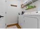 Bright laundry room with shelving and modern washer and dryer set at 5832 Emmert Way, Indianapolis, IN 46221