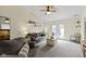 Spacious living area with plush seating, neutral carpet, and bright natural light at 5832 Emmert Way, Indianapolis, IN 46221
