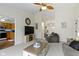 Open-concept living room with entertainment area, fireplace, and seamless flow to the kitchen at 5832 Emmert Way, Indianapolis, IN 46221