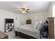 Well-lit main bedroom featuring a ceiling fan and ample closet space at 5832 Emmert Way, Indianapolis, IN 46221