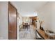 Open dining area leading to the kitchen, showcasing hardwood floors and a stylish dining set at 602 Liberty St, Middletown, IN 47356