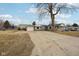 View of the detached garage and wide driveway, offering ample parking and backyard access at 602 Liberty St, Middletown, IN 47356