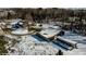 Aerial view of the property, featuring the house, barn, and surrounding snowy landscape at 6910 S 175 W, Columbus, IN 47201