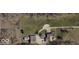 Aerial view of the expansive property, showcasing the home, barn, and driveway at 6910 S 175 W, Columbus, IN 47201