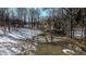 Picturesque backyard scene with bare trees and a small, frozen pond at 6910 S 175 W, Columbus, IN 47201