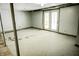 Unfinished basement area with white painted walls and an access door at 6910 S 175 W, Columbus, IN 47201