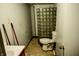 Bathroom featuring a unique glass block shower and essential fixtures at 6910 S 175 W, Columbus, IN 47201
