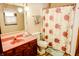 Bathroom featuring a colorful shower curtain and a vanity sink at 6910 S 175 W, Columbus, IN 47201