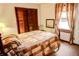 Charming bedroom with hardwood floors and patterned bedding at 6910 S 175 W, Columbus, IN 47201