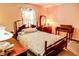 Bedroom with hardwood furniture and a decorative bedspread at 6910 S 175 W, Columbus, IN 47201