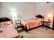 Bedroom featuring matching twin beds with pink, quilted bedspreads at 6910 S 175 W, Columbus, IN 47201