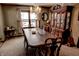 Traditional dining room featuring a decorative chandelier and hardwood hutch at 6910 S 175 W, Columbus, IN 47201