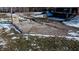Gravel driveway and parking area with a wooden framed shelter and view of the home at 6910 S 175 W, Columbus, IN 47201