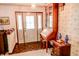 Bright entryway featuring a decorative front door and wooden desk at 6910 S 175 W, Columbus, IN 47201