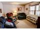 Cozy living room with carpeted floors and comfortable seating at 6910 S 175 W, Columbus, IN 47201