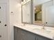 Bathroom boasts a double vanity with quartz countertop and matching framed mirrors at 7044 Bel Moore Cir, Indianapolis, IN 46259