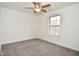 Bedroom with neutral carpet, ceiling fan with light, and bright window at 7044 Bel Moore Cir, Indianapolis, IN 46259