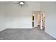 Bedroom leading to bathroom and closet, features include neutral carpet and white walls at 7044 Bel Moore Cir, Indianapolis, IN 46259