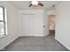 Bedroom includes a double closet, window, ceiling fan, and neutral carpet at 7044 Bel Moore Cir, Indianapolis, IN 46259