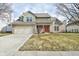 Inviting two-story home featuring a brick facade, two-car garage, and well-maintained lawn at 7044 Bel Moore Cir, Indianapolis, IN 46259