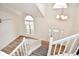 Bright foyer with a two-story ceiling, large windows, and a modern chandelier, creating a grand entrance at 7044 Bel Moore Cir, Indianapolis, IN 46259