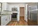 Well-equipped kitchen with stainless steel appliances, granite countertops, and white cabinets at 7044 Bel Moore Cir, Indianapolis, IN 46259