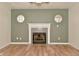 Cozy living room featuring a fireplace with decorative trim and detailed windows at 7044 Bel Moore Cir, Indianapolis, IN 46259