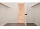 Carpeted walk-in closet with double rods and view to a bright bathroom at 7044 Bel Moore Cir, Indianapolis, IN 46259