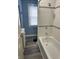 Bathroom with a tub, tiled shower, new vanity and modern fixtures at 721 N Grant Ave, Indianapolis, IN 46201