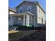 Charming two-story home with a covered front porch and classic architectural details at 721 N Grant Ave, Indianapolis, IN 46201