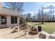 Backyard featuring a wooden deck with outdoor furniture, complemented by a lush lawn at 7411 Perrier Dr, Indianapolis, IN 46278