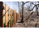 A well-maintained wooden fence that runs along the property line, providing security and privacy to the backyard at 7411 Perrier Dr, Indianapolis, IN 46278