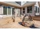 Wooden deck featuring a built-in fire pit with seating, perfect for outdoor relaxation and entertainment at 7411 Perrier Dr, Indianapolis, IN 46278