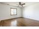 Bright bedroom featuring a hardwood floors, and a ceiling fan at 7411 Perrier Dr, Indianapolis, IN 46278