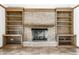 Close-up of fireplace with built-in shelving for decor and organization at 7411 Perrier Dr, Indianapolis, IN 46278