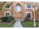 Charming front entrance with a decorative door, large window, and manicured landscaping at 7411 Perrier Dr, Indianapolis, IN 46278